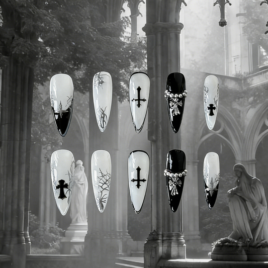 Luxthorn press-on nails by MYOB Nails featuring bold black French tips, silver crosses, and chrome thorns on sheer white.