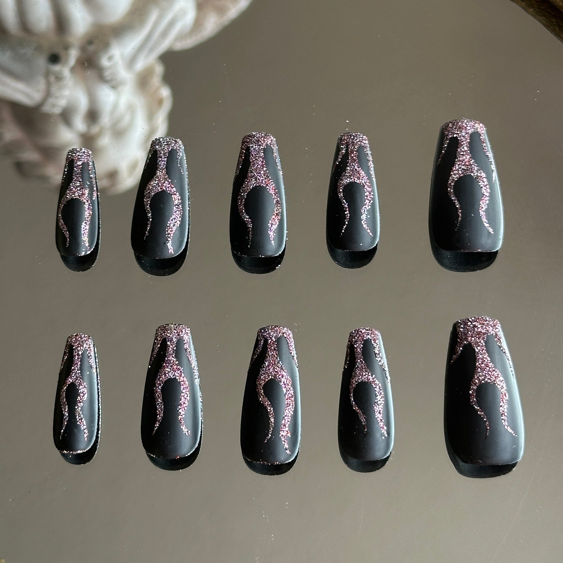 Back view of the handcrafted set showcasing the dynamic and organic flame shapes on each nail.