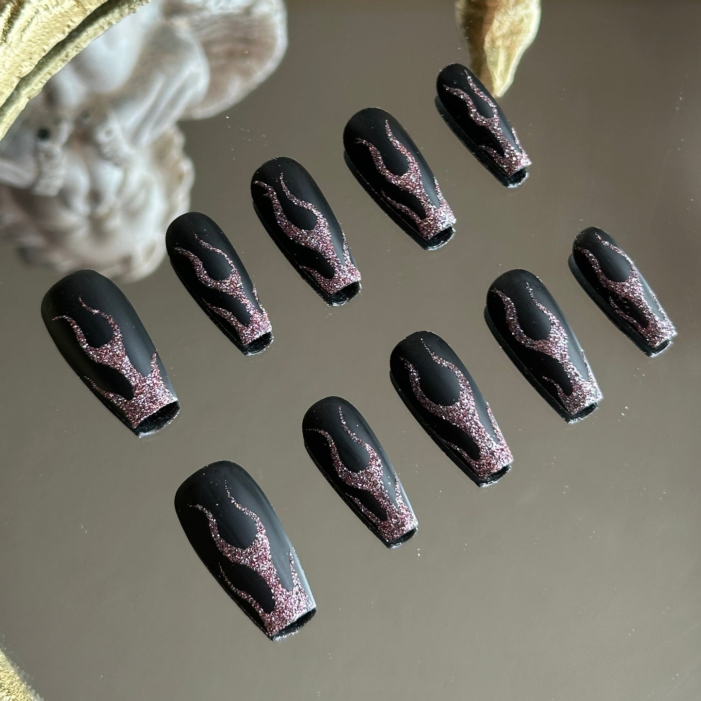 Close-up detail of the 3D textured red glitter flames, highlighting the raw crystal-like sparkle.