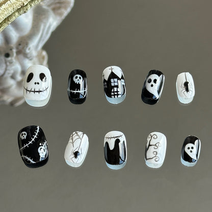 Front view of Midnight Masquerade handmade press-on nails by MYOB Nails featuring hand-painted ghosts, skeletons, and spider webs.