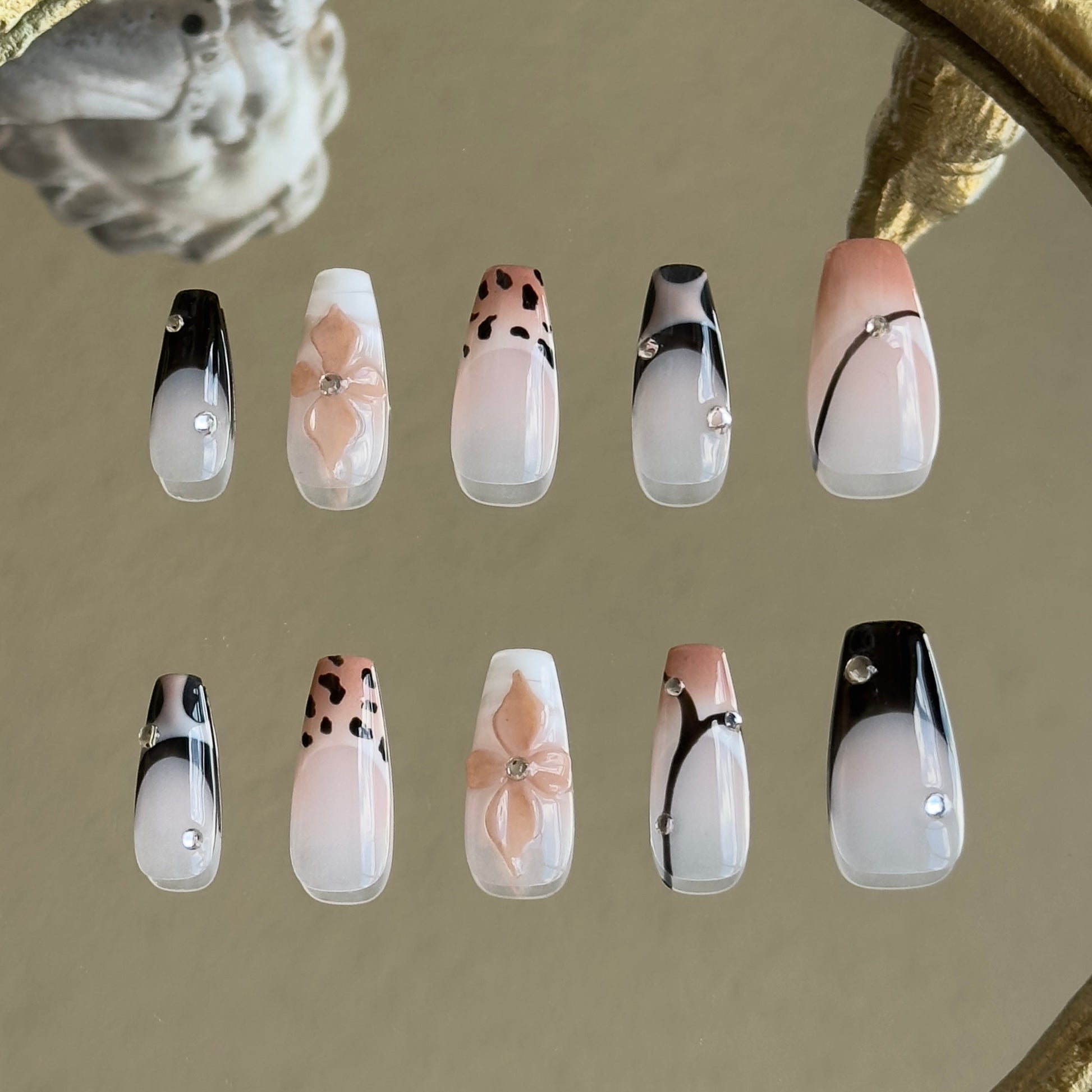 Back view of the Mocha Swirl handcrafted nail set by MYOB Nails, displaying a cohesive and chic modern aesthetic.
