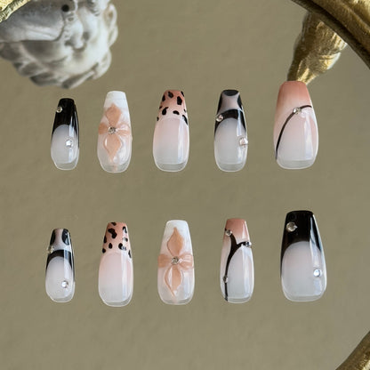 Back view of the Mocha Swirl handcrafted nail set by MYOB Nails, displaying a cohesive and chic modern aesthetic.