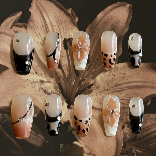 MYOB Nails' Mocha Swirl press-on nails featuring elegant brown gradient, animal print accents, and delicate embellishments.