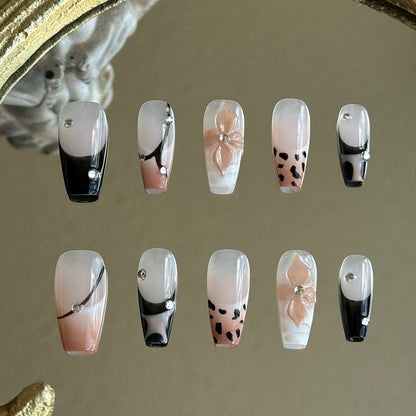 Front view of Mocha Swirl handmade press-on nails by MYOB Nails featuring leopard print, 3D floral art, and black-to-nude gradients.