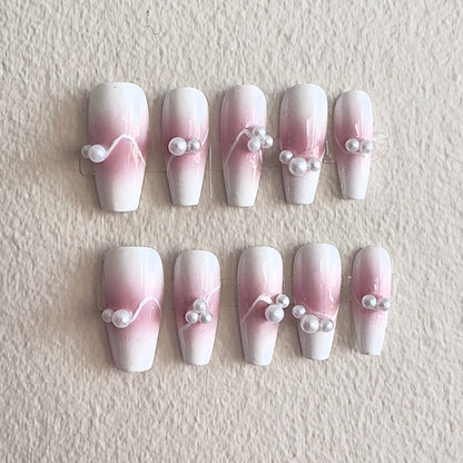 MYOB Nails elegant pink and white ombre press-on nails featuring delicate flowing white line art and minimalist pearl accents, perfect for a sophisticated look.