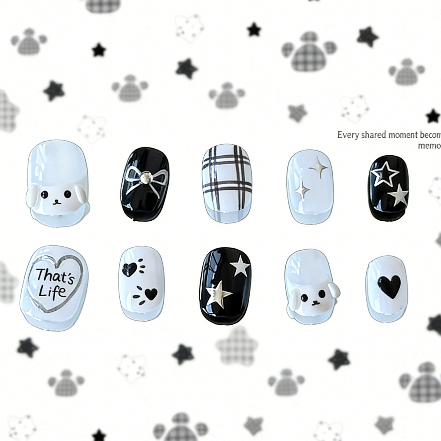 Full set of MYOB Nails PupStar press-on nails in minimalist black and white, featuring 3D puppy charms, silver "That's Life" heart art, and star doodles.