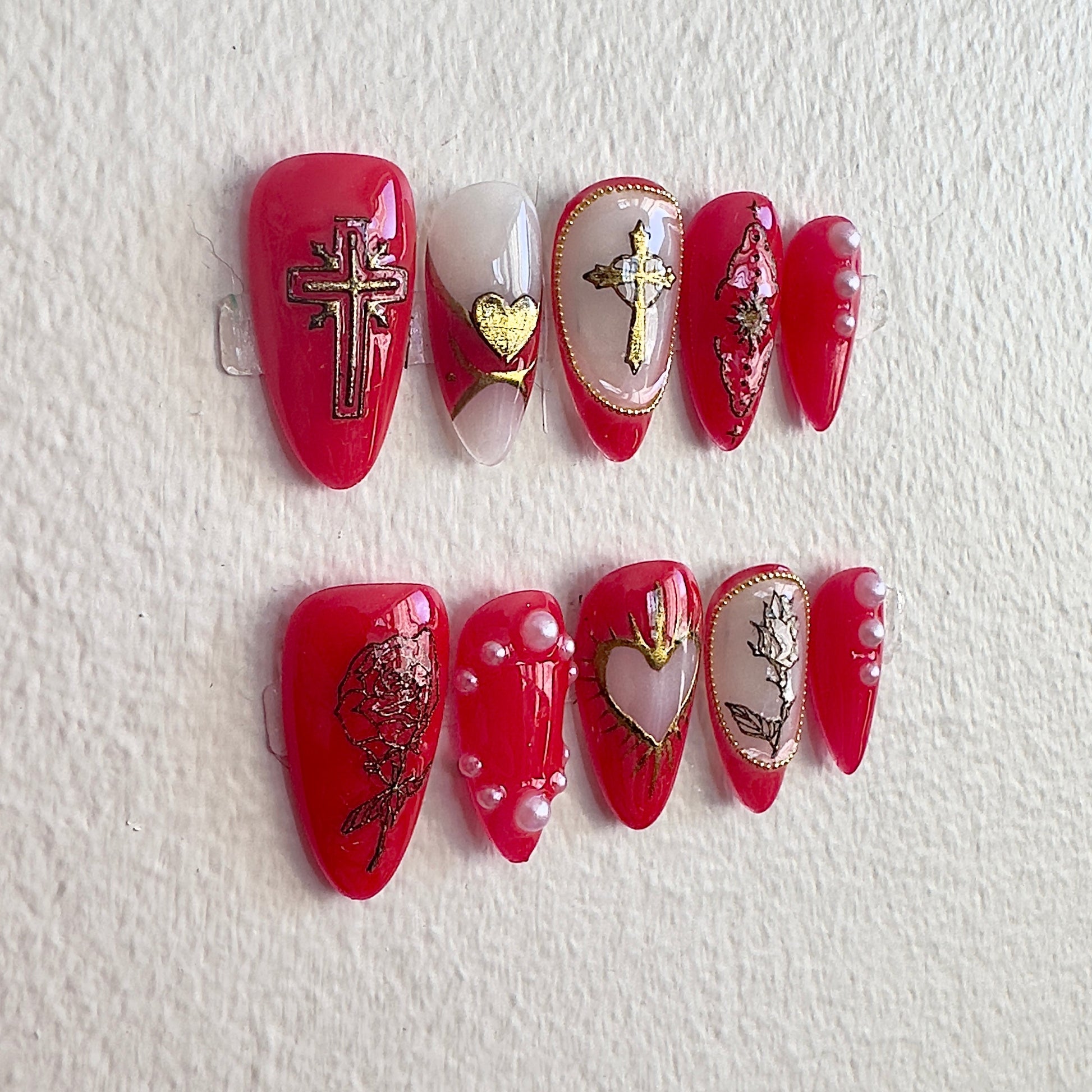 Left side view of Rosarium set highlighting 3D gold crosses and pearl accents.