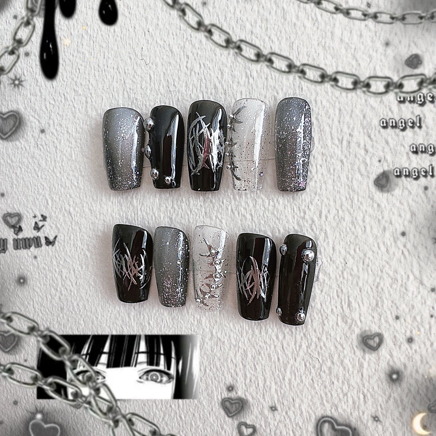 Detailed left side view of Thornspine press-on nails highlighting the intricate 3D silver thorn charms and metallic textures.