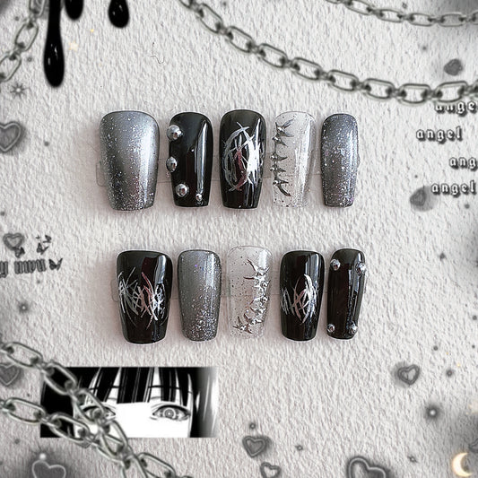 Front view of MYOB Nails Thornspine collection featuring 3D silver thorns, chrome liquid metal lines, and dark glitter accents.