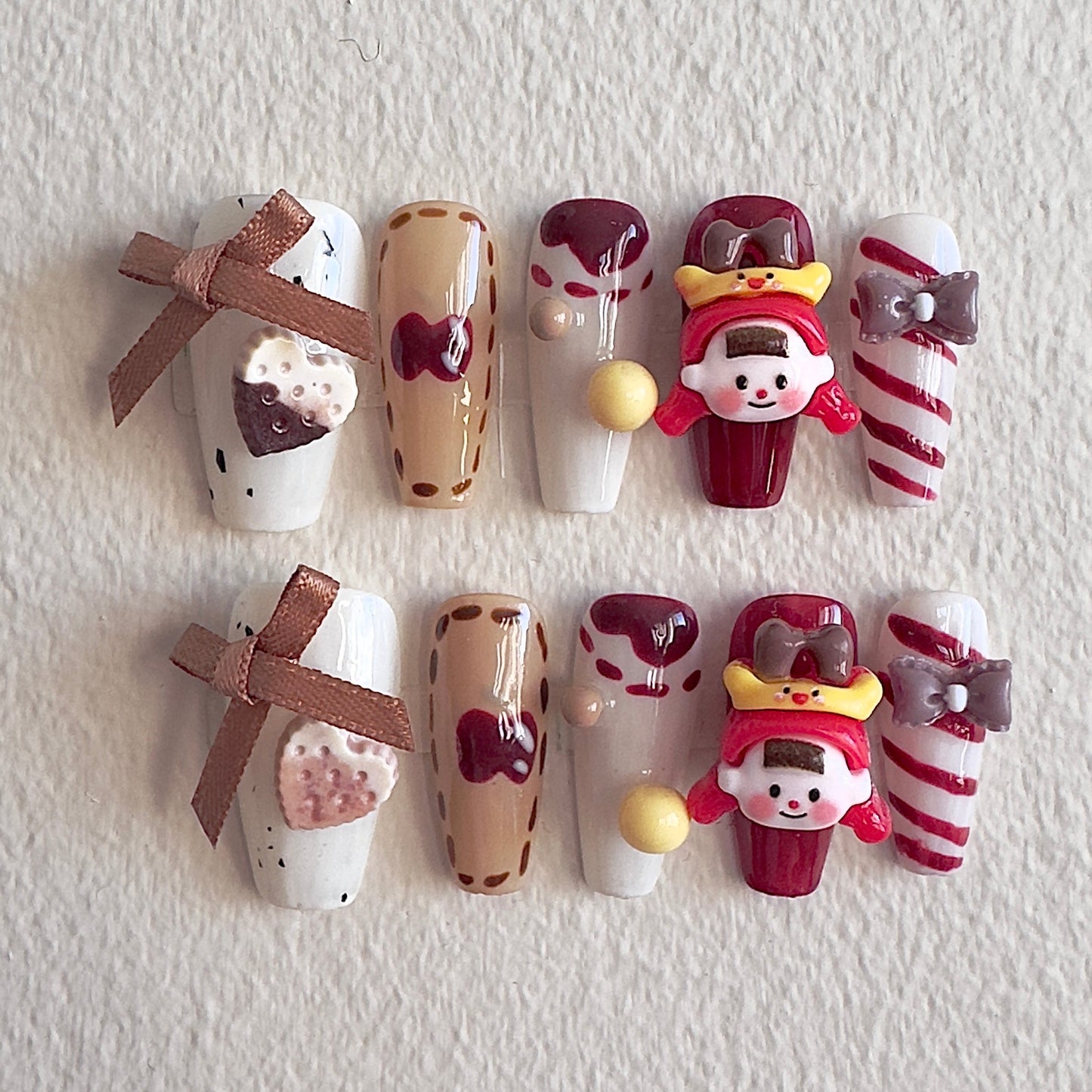 Vintage sweet shop themed nails with 3D doll charms and chocolate accents by MYOB Nails