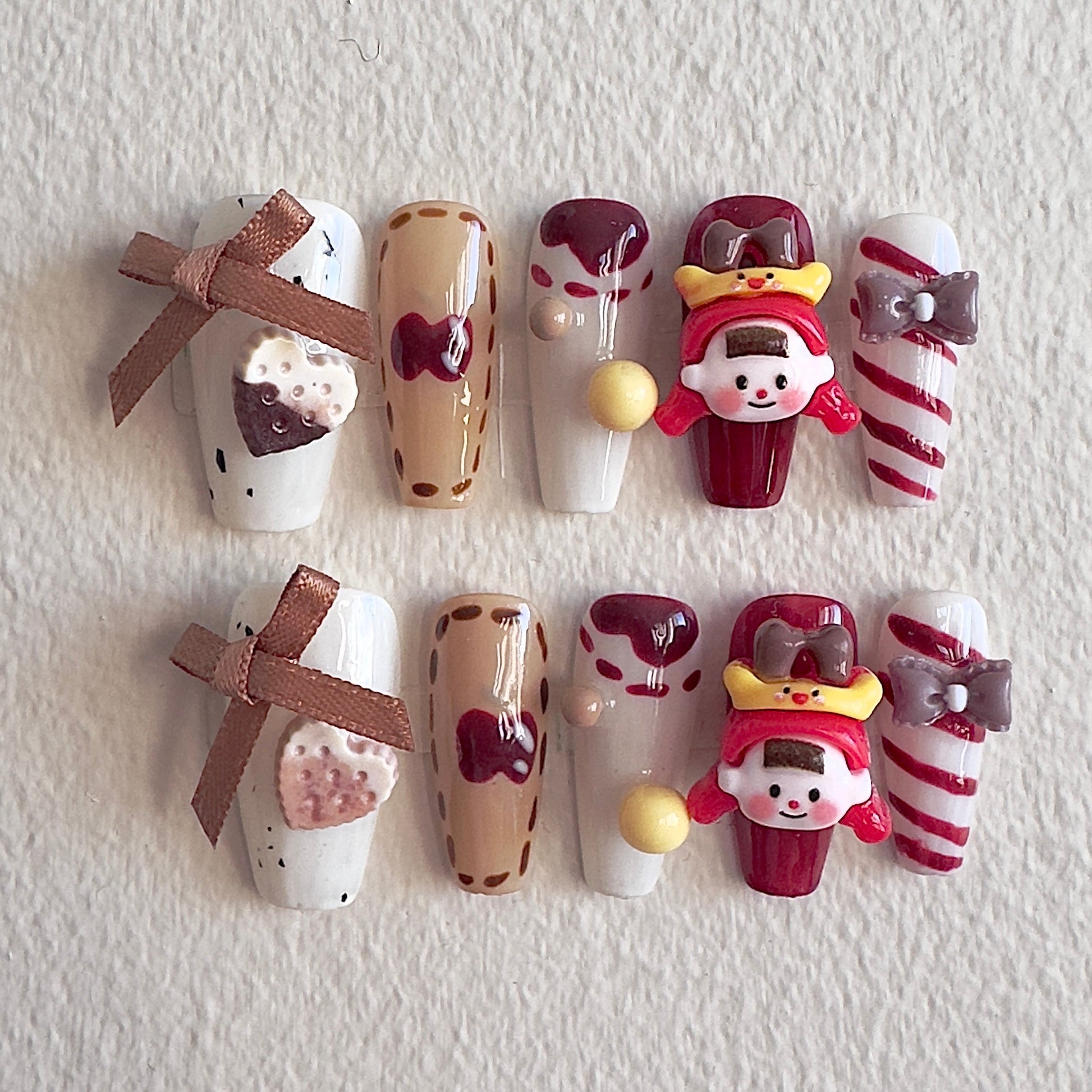 Vintage sweet shop themed nails with 3D doll charms and chocolate accents by MYOB Nails