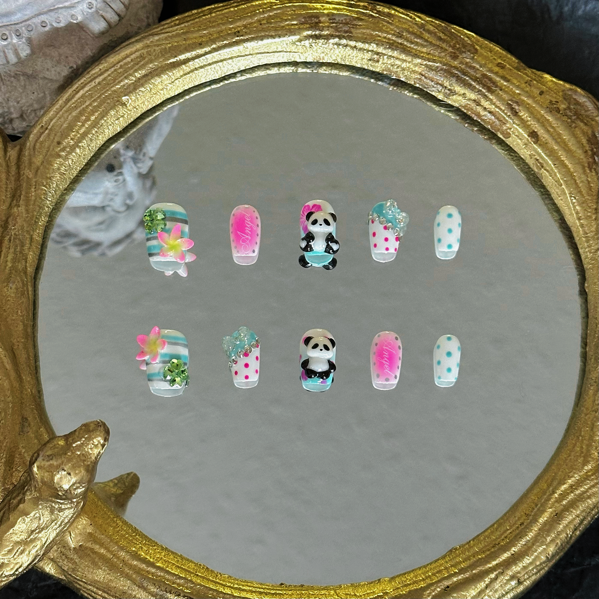 MYOB Nails Y2K panda and hibiscus coffin press-on nails, front view, featuring neon pink, mint green, and silver details, playful 3D panda charms, hibiscus accents, and polka dot prints, retro custom manicure for self-expression, no trends just you