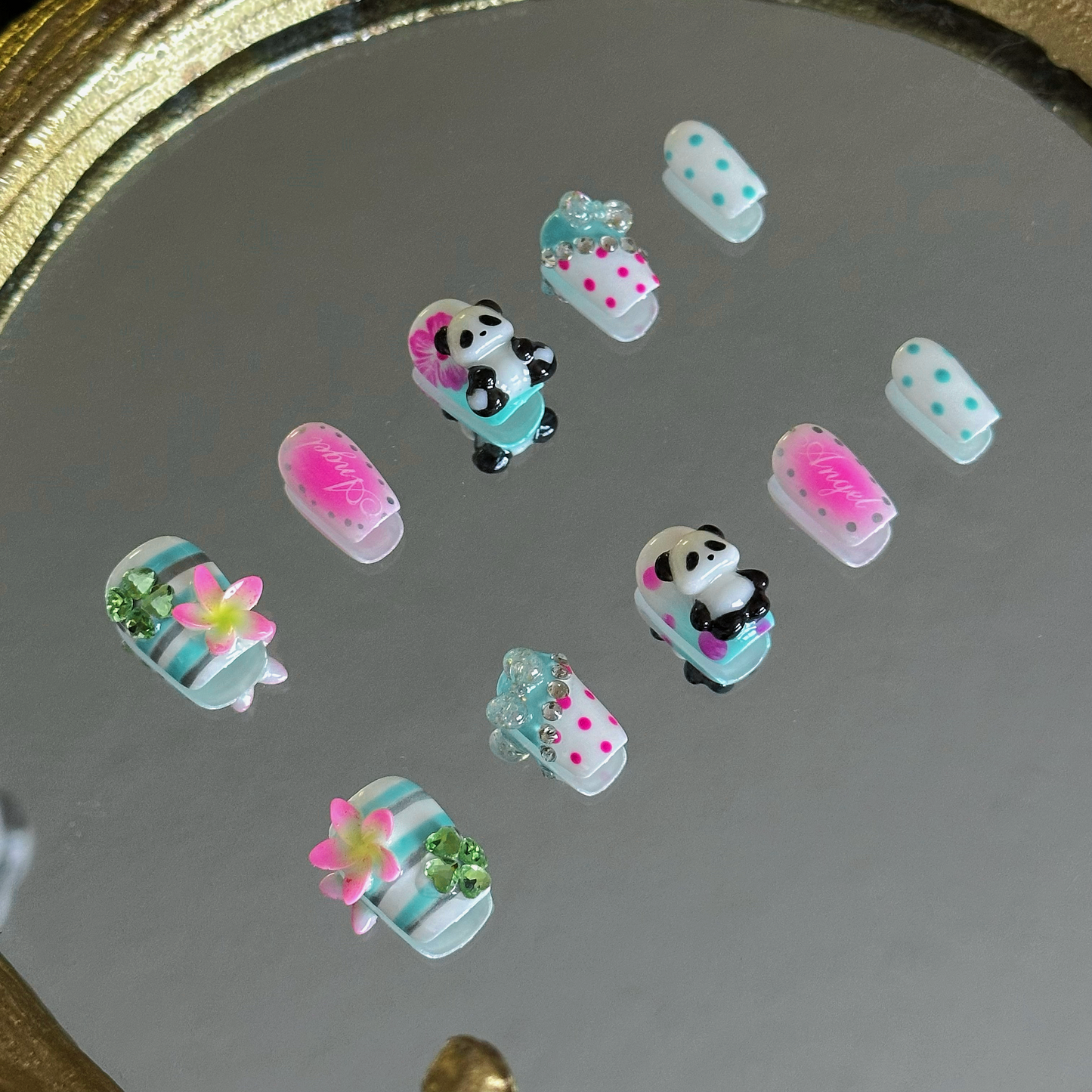 MYOB Nails Y2K panda and hibiscus coffin press-on nails, left side view, showing 3D panda and flower details, neon pink and mint green accents, retro custom manicure