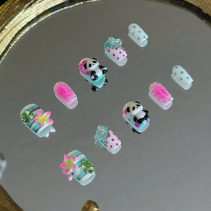 MYOB Nails Y2K panda and hibiscus coffin press-on nails, left side view, showing 3D panda and flower details, neon pink and mint green accents, retro custom manicure
