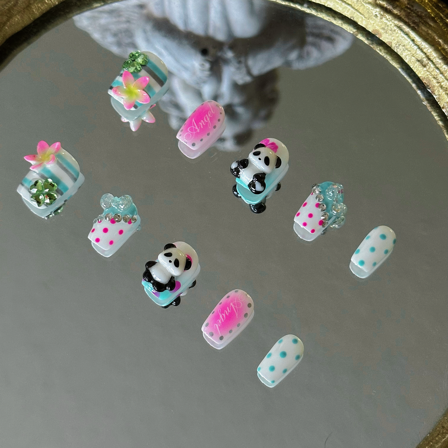MYOB Nails Y2K panda and hibiscus square press-on nails, right side view, highlighting 3D charms and polka dot prints, neon pink and mint green design, retro custom manicure