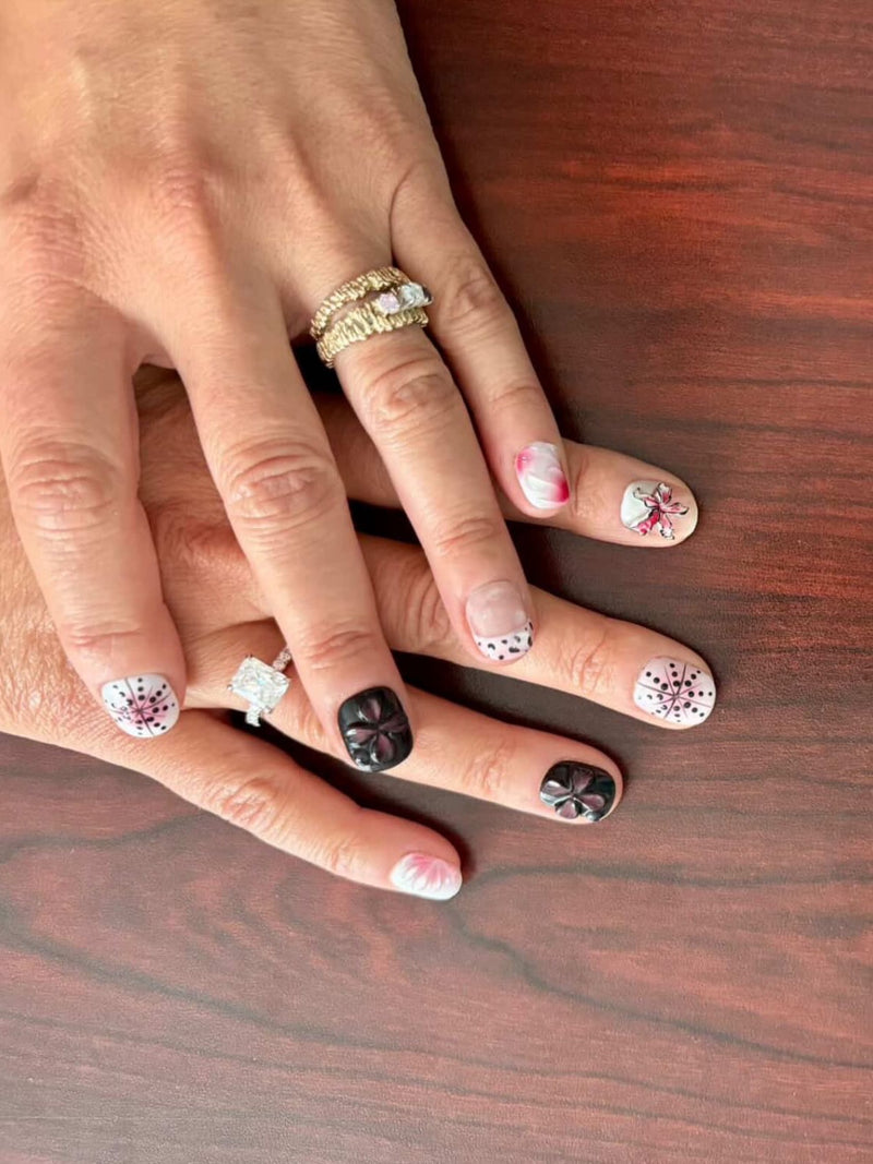 a photo from client showing custom dusk orchid nails from myobnails on her hand