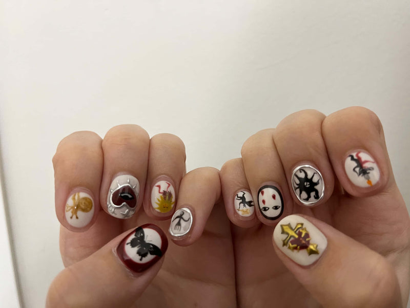 a photo from client showing a custom hand-painted set on their hand