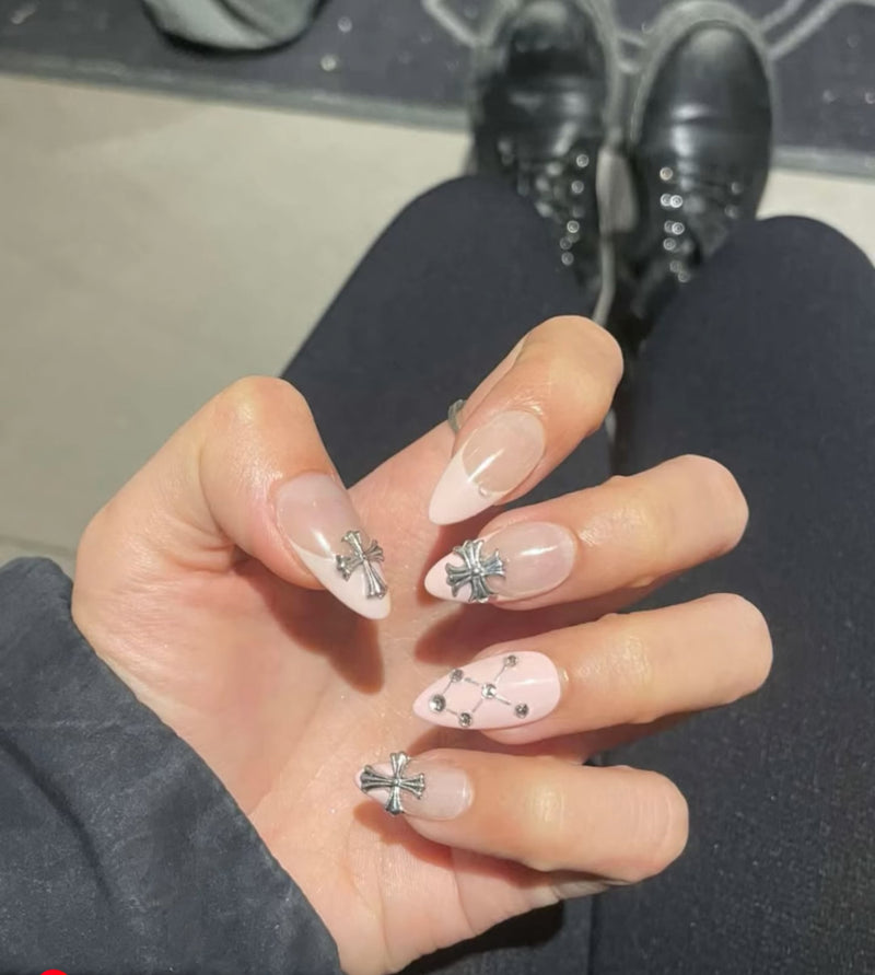 a photo from customer showing pink cross custom set from myobnails