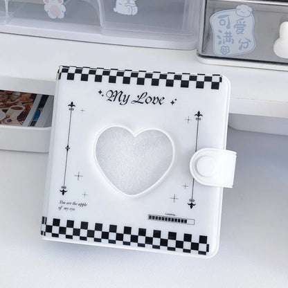 white and black nail storage book with heart shape hollow.