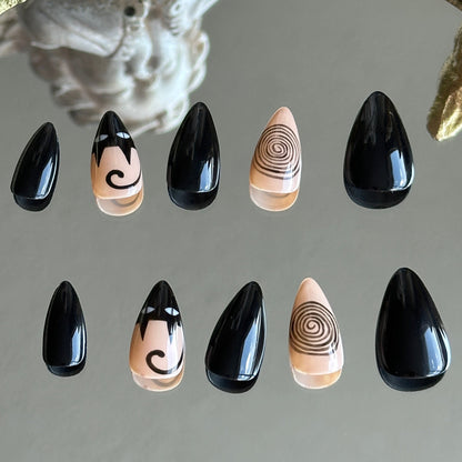 Back view of the Noir Whimsy handcrafted nail set by MYOB Nails, showcasing a minimalist yet whimsical black and beige aesthetic.