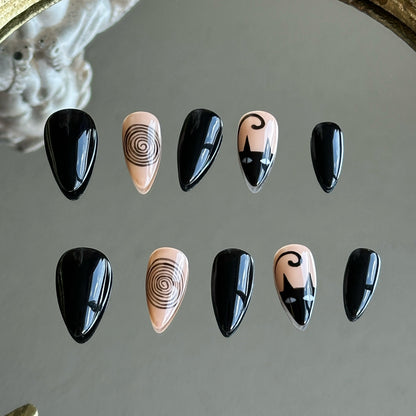 Front view of Noir Whimsy handmade press-on nails by MYOB Nails with elegant black and beige cat silhouettes and spiral art.