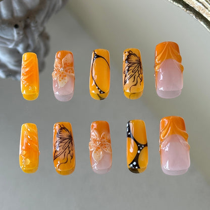 Back view highlighting the high-gloss finish and the artistic multi-layered design of the Orange Sunset set.