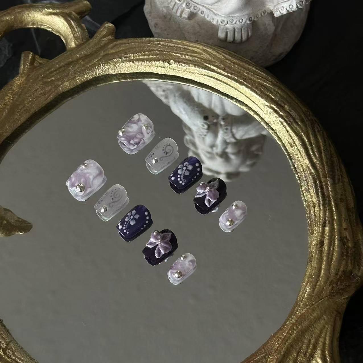 Detailed shot of the handcrafted 3D purple orchid and precision-placed silver steel beads on the Orchid Mirage set.