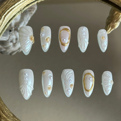 Front view of Oyster Belle handmade nails by MYOB Nails featuring iridescent shell textures and elegant 3D pearl clusters.