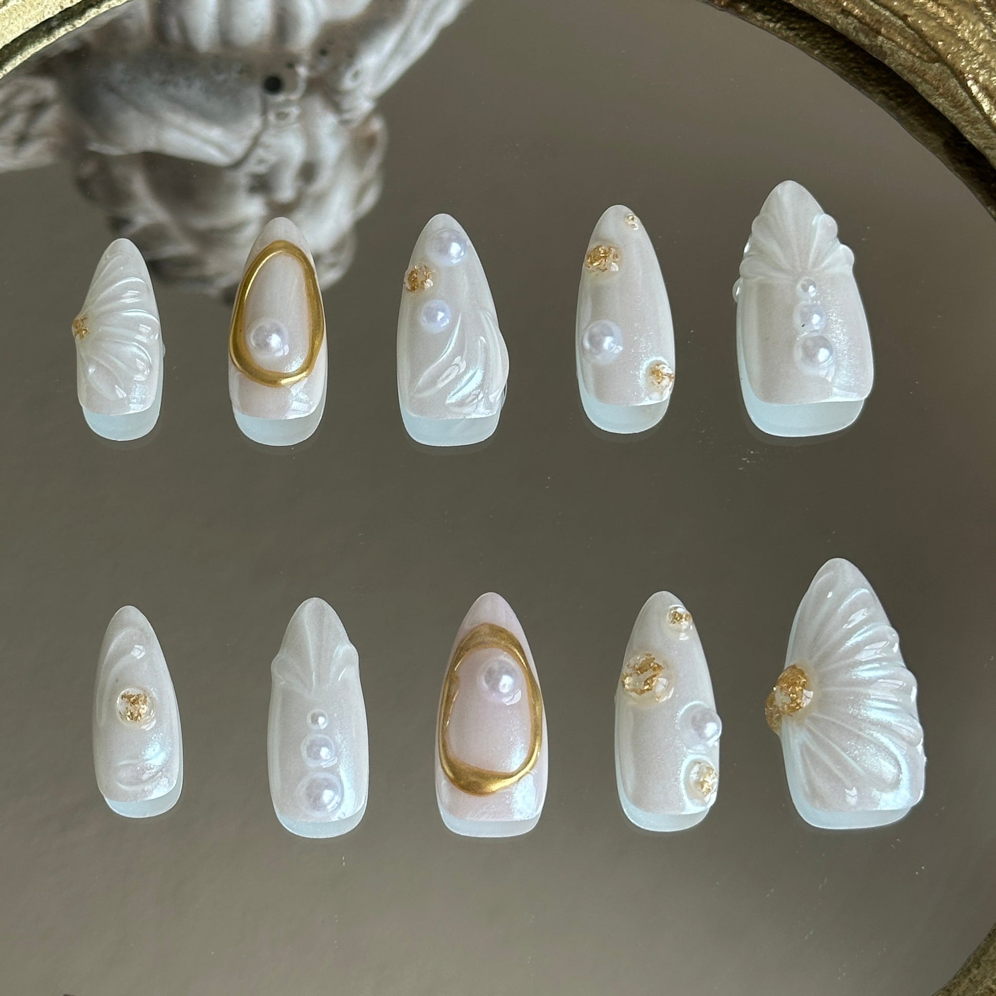 Back view of the Oyster Belle handcrafted nail set by MYOB Nails, showcasing a seamless, translucent mermaid-core aesthetic.