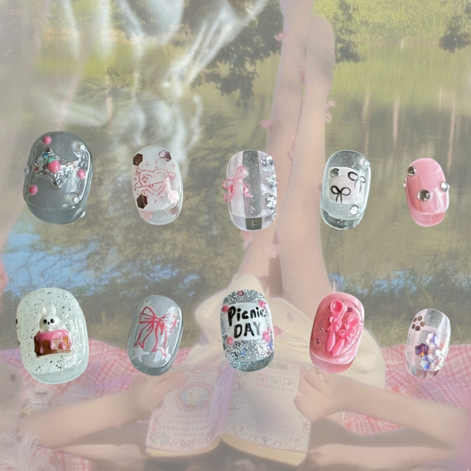 Picnic Day press-on nails by MYOB Nails featuring 3D bunny cakes, miniature forks, and spoons on a glittery base.