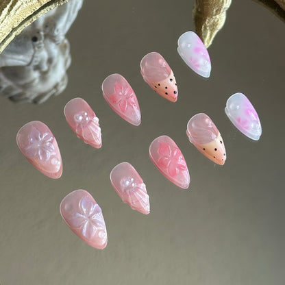 Left side detail highlighting the intricate 3D handcrafted flowers and delicate pearl centers by MYOB Nails.