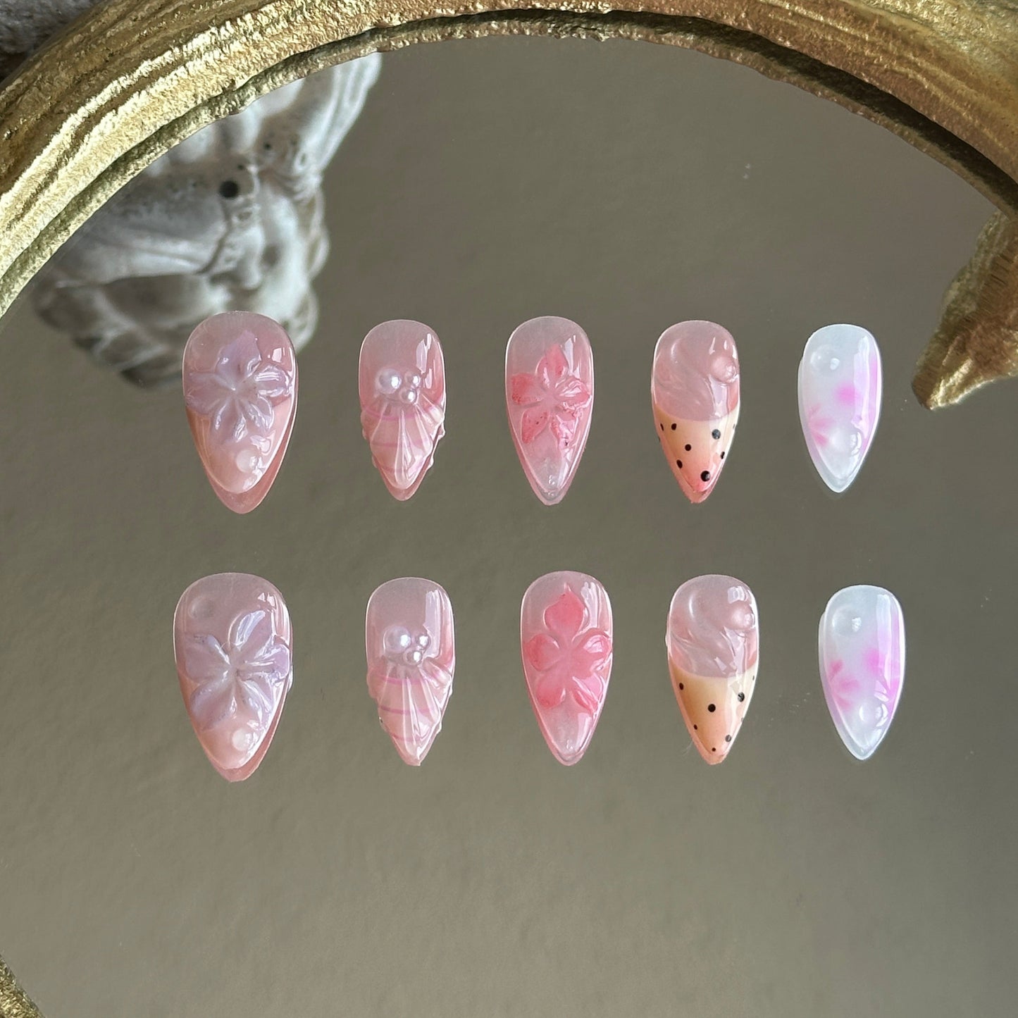 Front view of Pink Garden handmade nails showing sheer pink and pale yellow French tips with 3D floral accents.