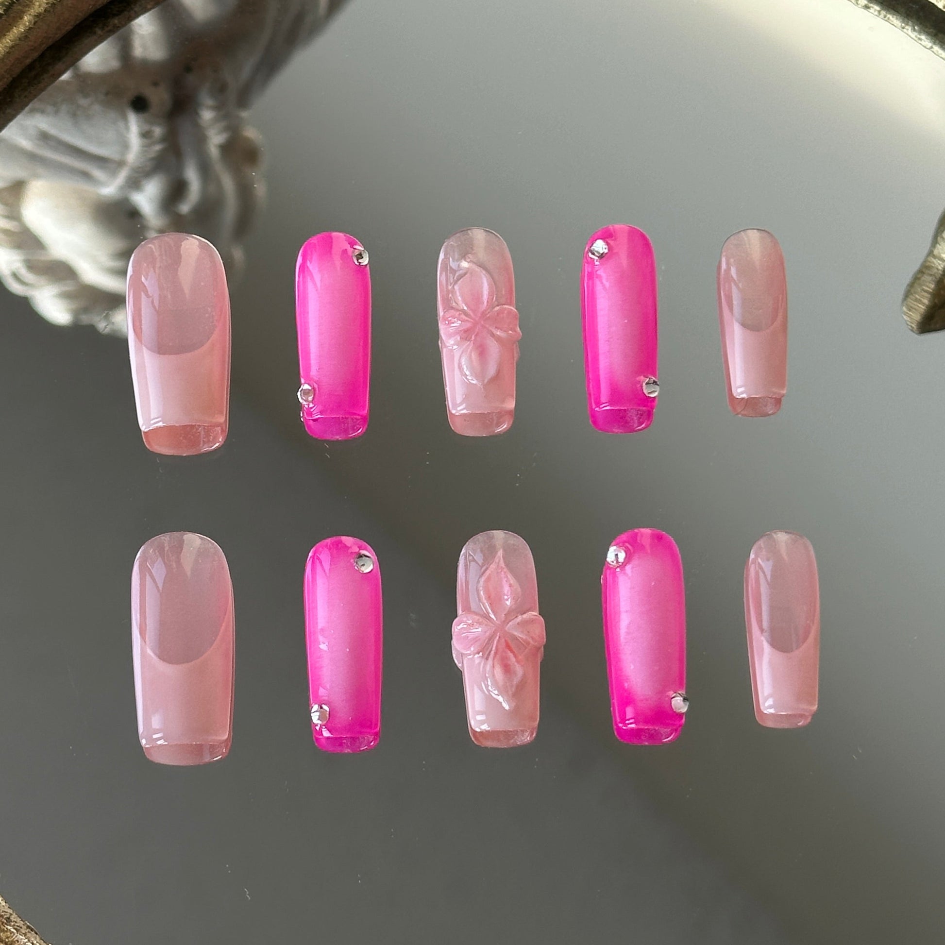Front view of Pink World handmade nails showing the blend of white blush gradients and delicate pink French tips.