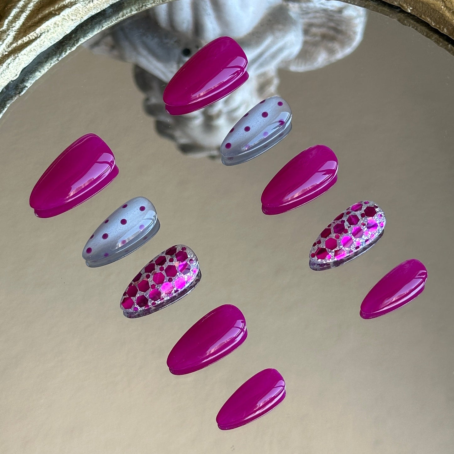 Right side view showcasing the delicate minimalist polka dot art on a shimmering plum base.