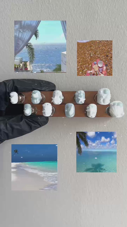 A behind-the-scenes look at the handcrafted process of Siren's Treasure press-on nails by MYOB Nails, transitioning from detailed artistry to the final shimmering 3D seashell result.