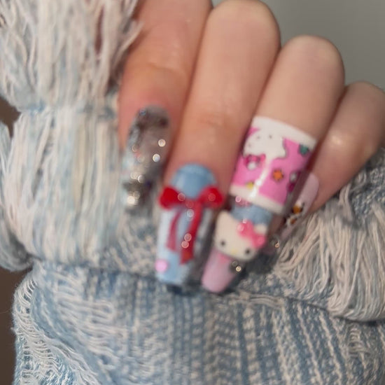 A dynamic video of a hand model showcasing the Cozy Cowgirl nails by MYOB Nails, capturing the light on the denim texture and 3D charms.