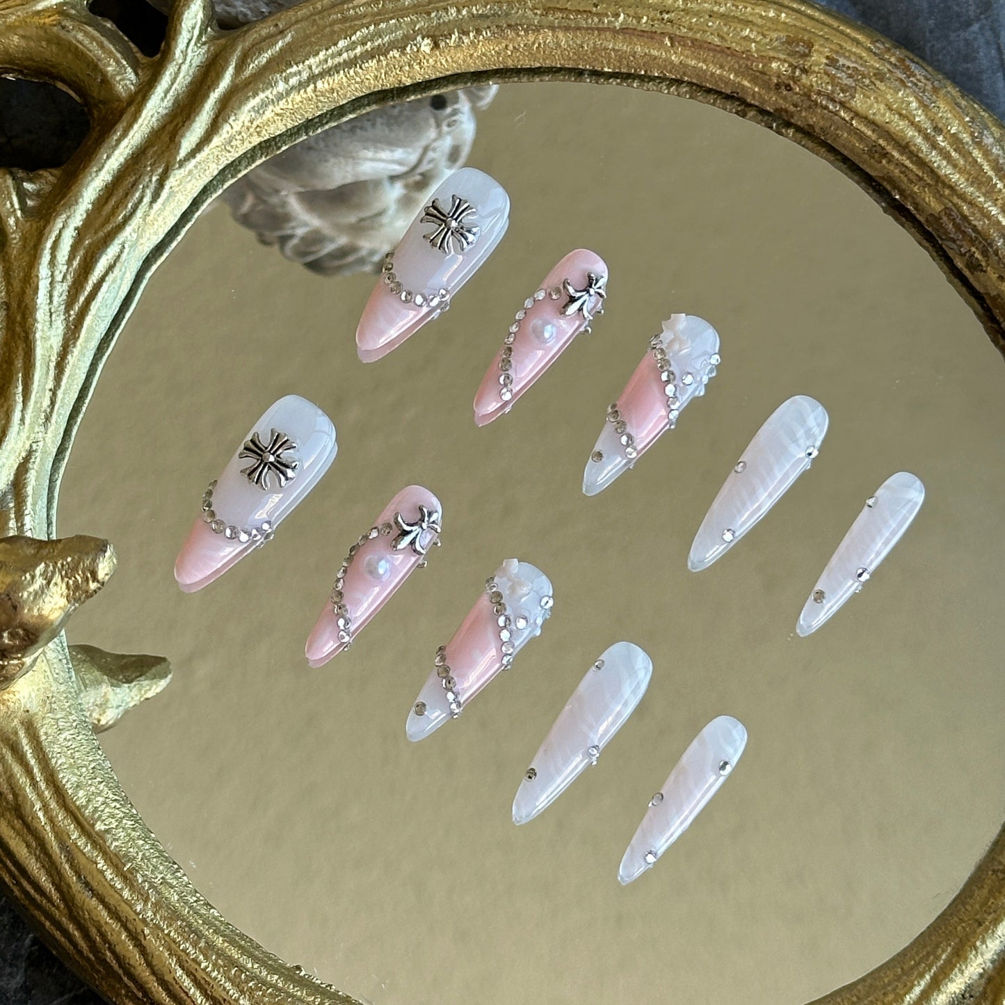 Right side view of Princess Rebel nails by MYOB Nails showing the metallic chain wrap and shimmering marble textures.