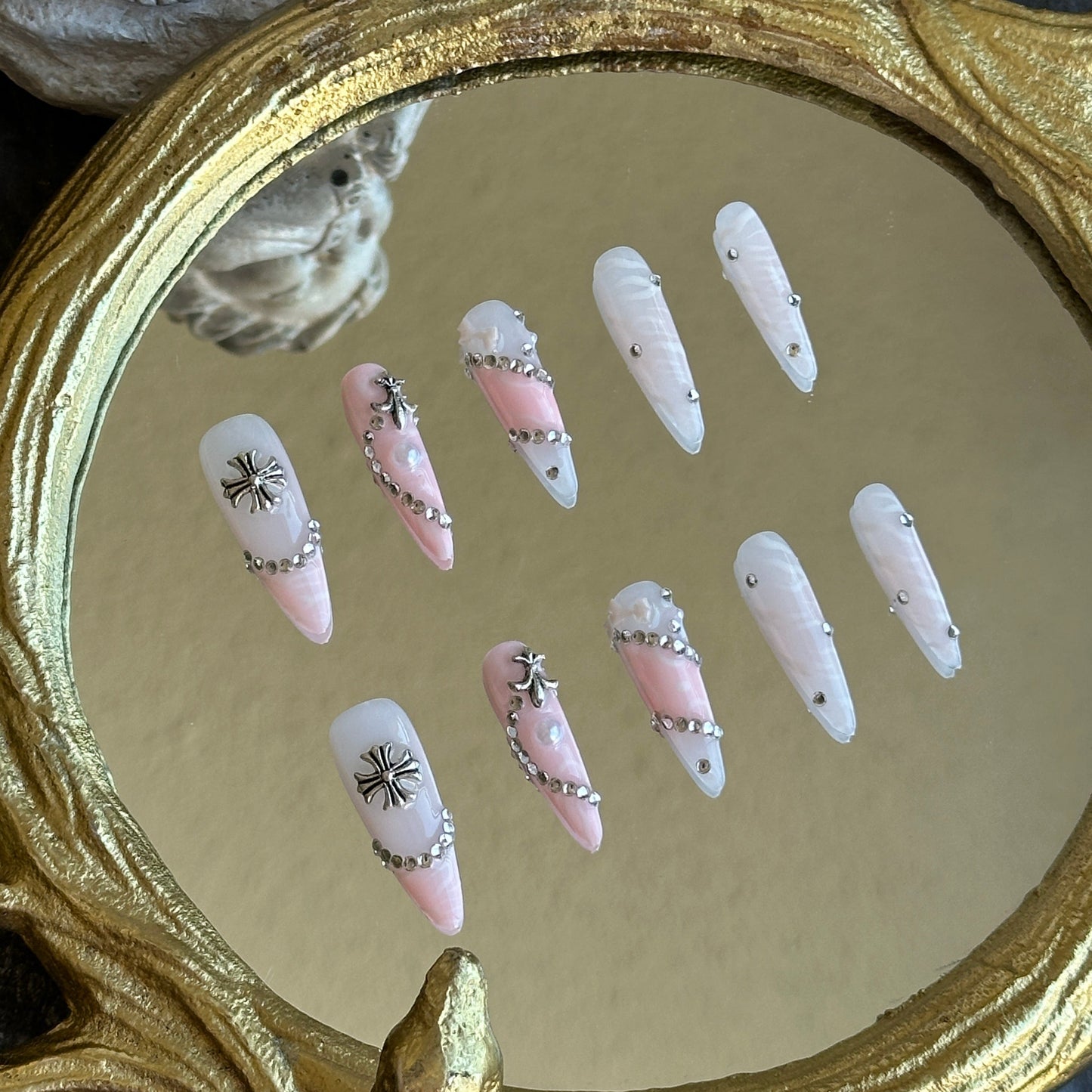 Left side view of MYOB Nails Princess Rebel set highlighting the intricate silver cross charms and crystal embellishments.