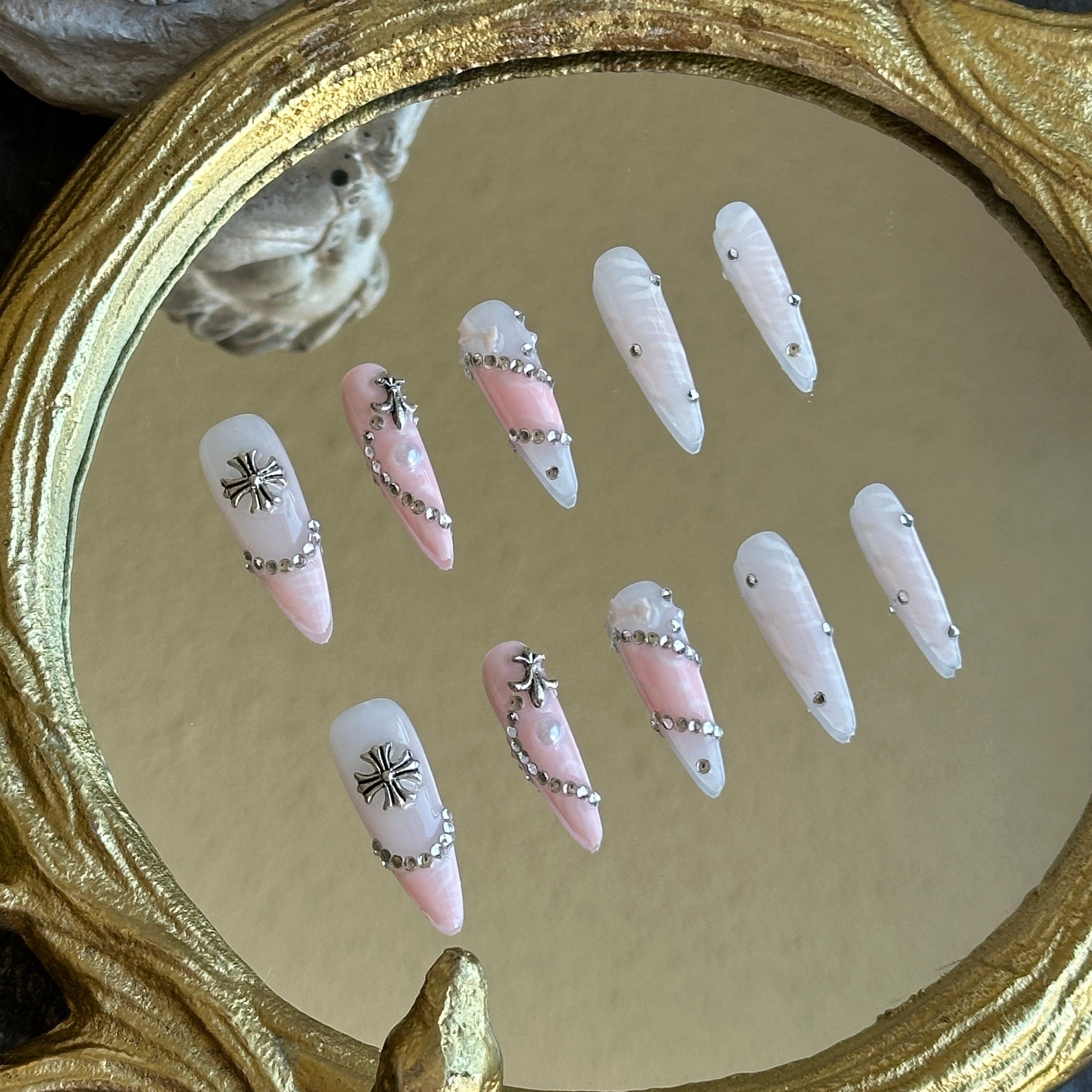 Left side view of MYOB Nails Princess Rebel set highlighting the intricate silver cross charms and crystal embellishments.