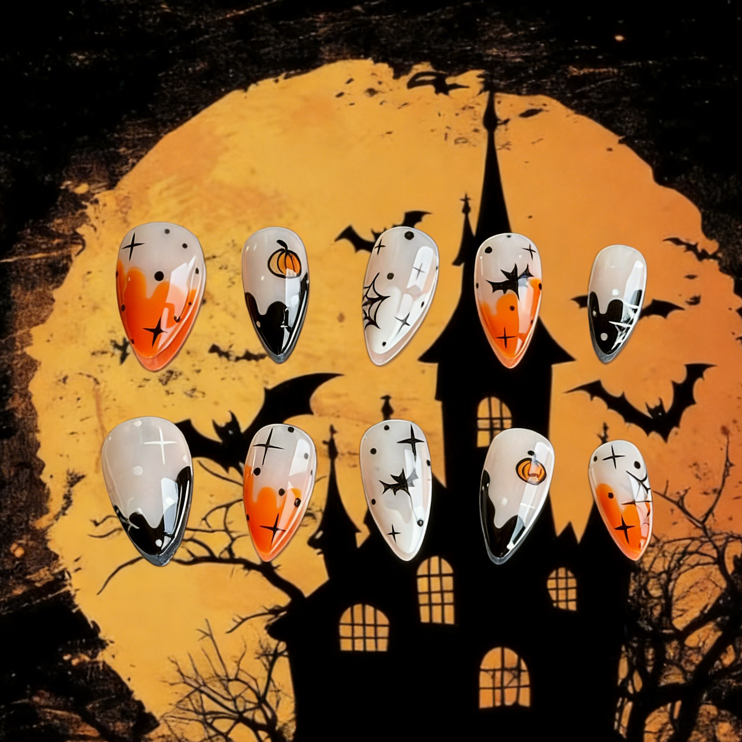 Pumpkin Spell press-on nails by MYOB Nails featuring pumpkin, bats  and Halloween-themed art.