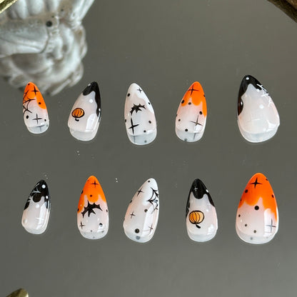 Back view of the Pumpkin Spell handcrafted nail set by MYOB Nails, showcasing a vibrant and spooky-chic aesthetic.