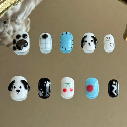 Front view of Puppy Love handmade press-on nails by MYOB Nails featuring 3D puppy paws, blue plaid, and cute dog art.
