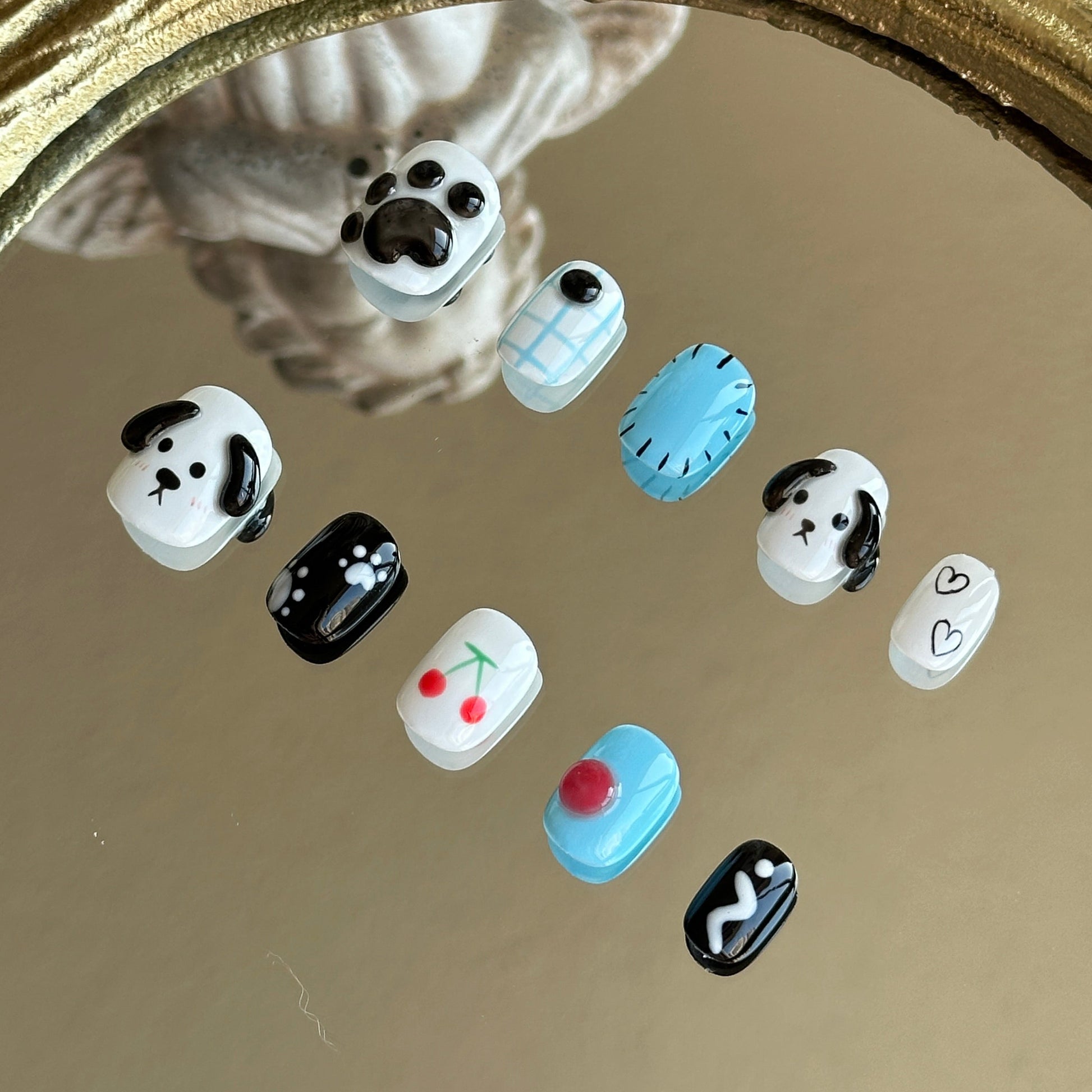Right side view of Puppy Love nails by MYOB Nails showing the hand-painted puppy face and refreshing blue-white plaid.