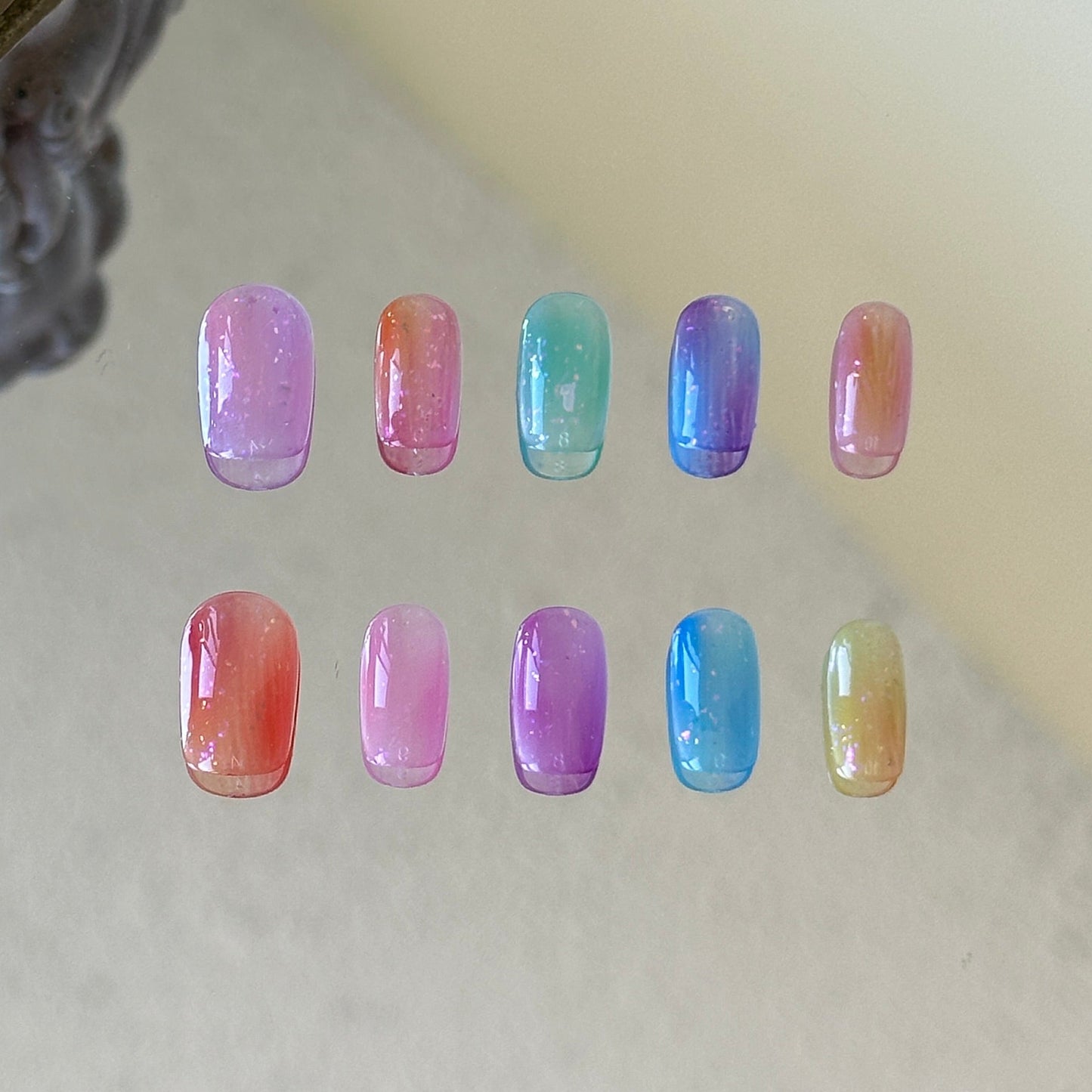 Front view of Rainbow handmade nails with vibrant multi-tonal pure color gradients.