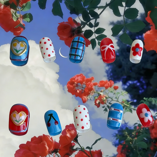 Retro Bloom press-on nails by MYOB Nails featuring red, blue, and white patterns displayed on a playful blue artistic background.