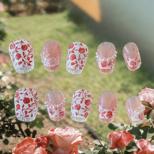 Rose Garden press-on nails by MYOB Nails featuring red rose prints, 3D roses, and pearl-lined French tips.