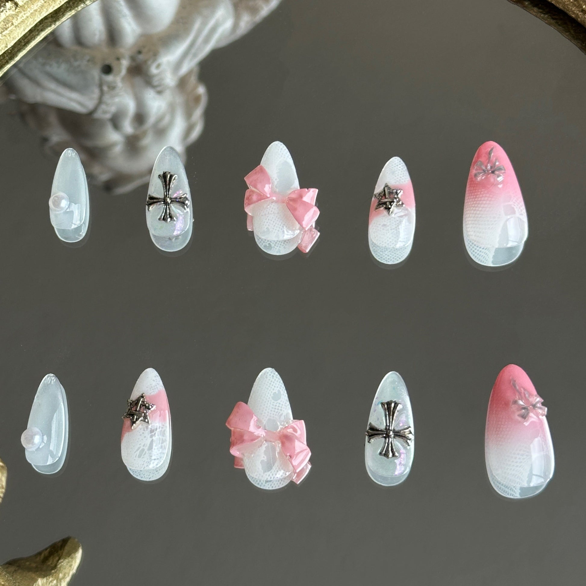 Back view of the Sacred Blush handcrafted nail set by MYOB Nails, showcasing a perfect blend of coquette and grunge styles.