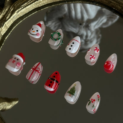 christmas themed nail set with handsculpted santa snowman, candies and wreath