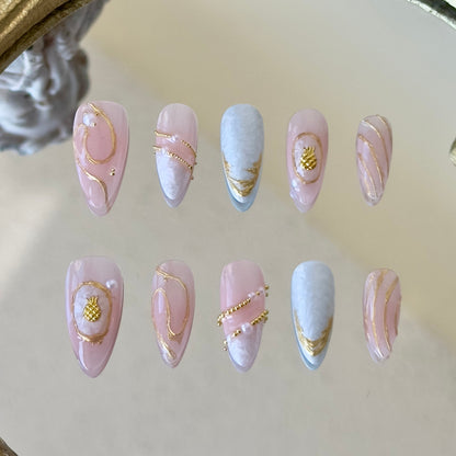 Front view of Seraphine nails showing the luminous sheer pink base, delicate pearls, and gold steel beads.