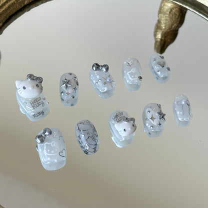 Left side detail of the nails highlighting the 3D silver chrome bows and metallic heart charms by MYOB Nails.